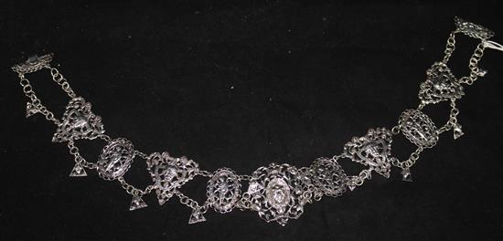 A late Victorian pierced silver necklace decorated with masks and figures by Rosenthal, Jacob & Co,